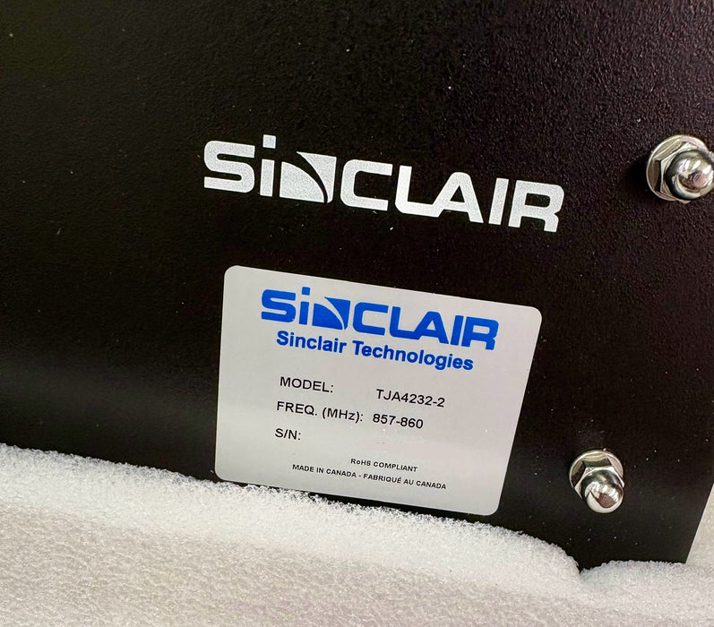 Sinclair Technologies label on a black device with screws.  Tja4232