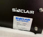 Sinclair Technologies label on a black device with screws.  Tja4232